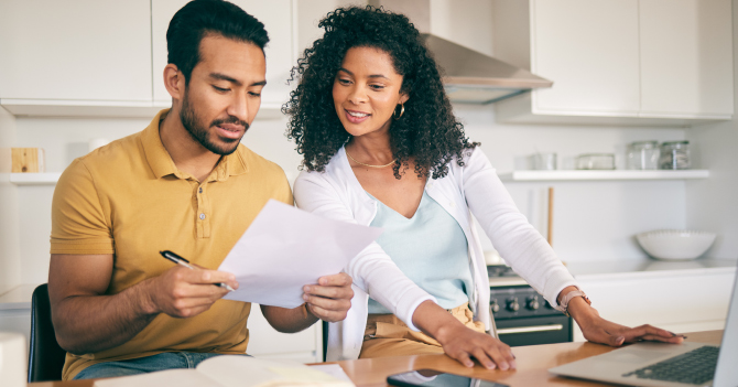 Couple reviewing finances together.