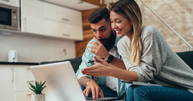 Couple checking finances on the computer