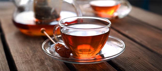 A cup of tea on a table.
