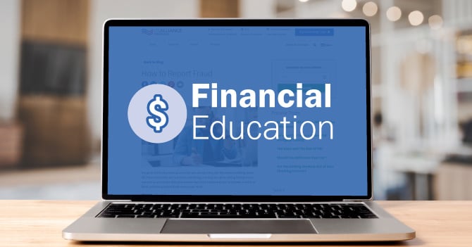 Laptop displaying the words "Financial Education" on a blue overlay.